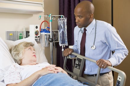doctor speaking to a patient in a hospital bed