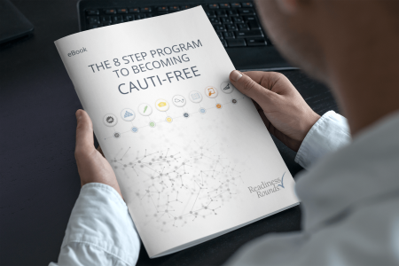 man holding a brochure titled The 8-Step Program to Becoming CAUTI-Free