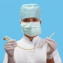 nurse with mask holding up a catheter