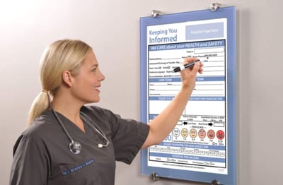 Nurse filling in a Patient Communication Board
