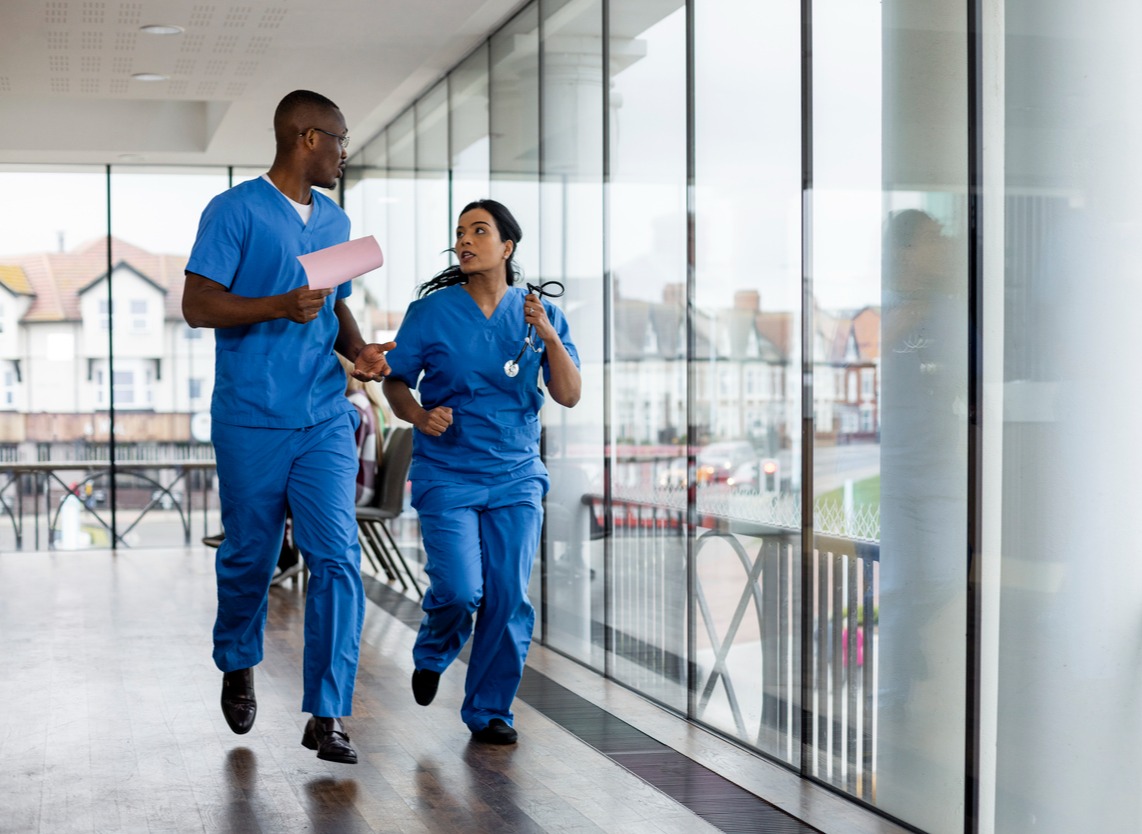 Two Nurses Running in the Hospital Hallway-1