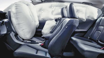 interior of a car with the airbag deployed