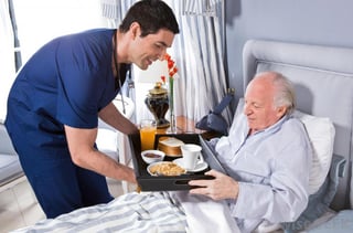 nurse-giving-man-food-in-hospital