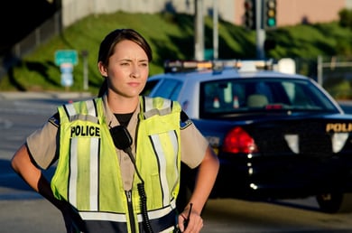 policewoman wearing a yellow vest